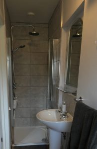 En suite shower room in double bedroom