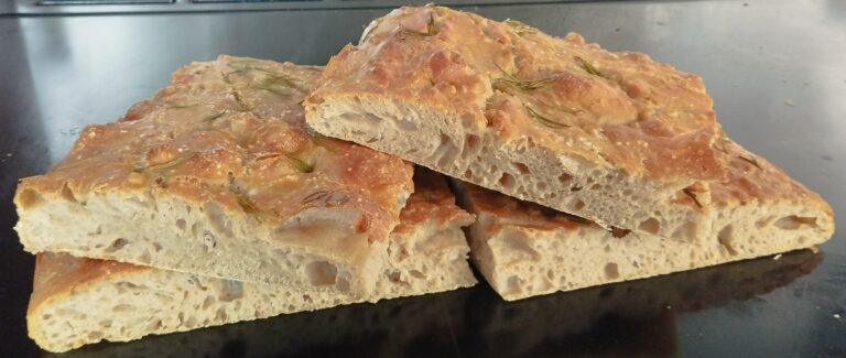 Freshly baked focaccia bread cut into 4 pieces