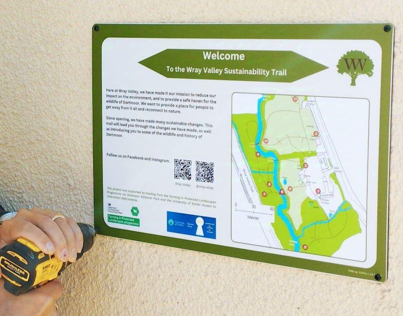 Erecting the signs for the Sustainability Activity Trail