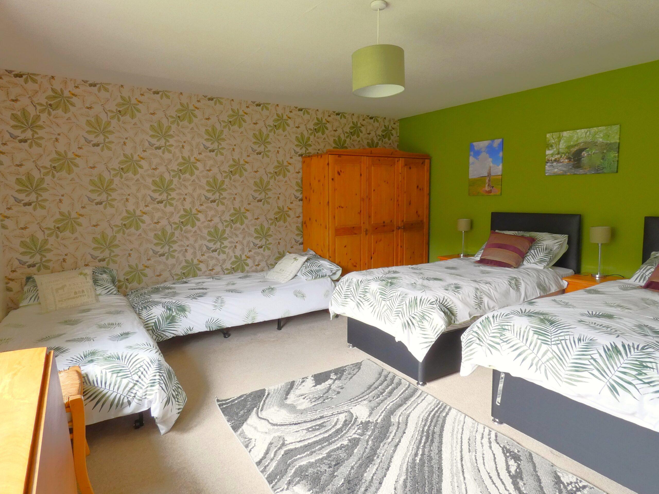 Bovey room made up with 4 single beds. Ideal for friends, and mixed generation families